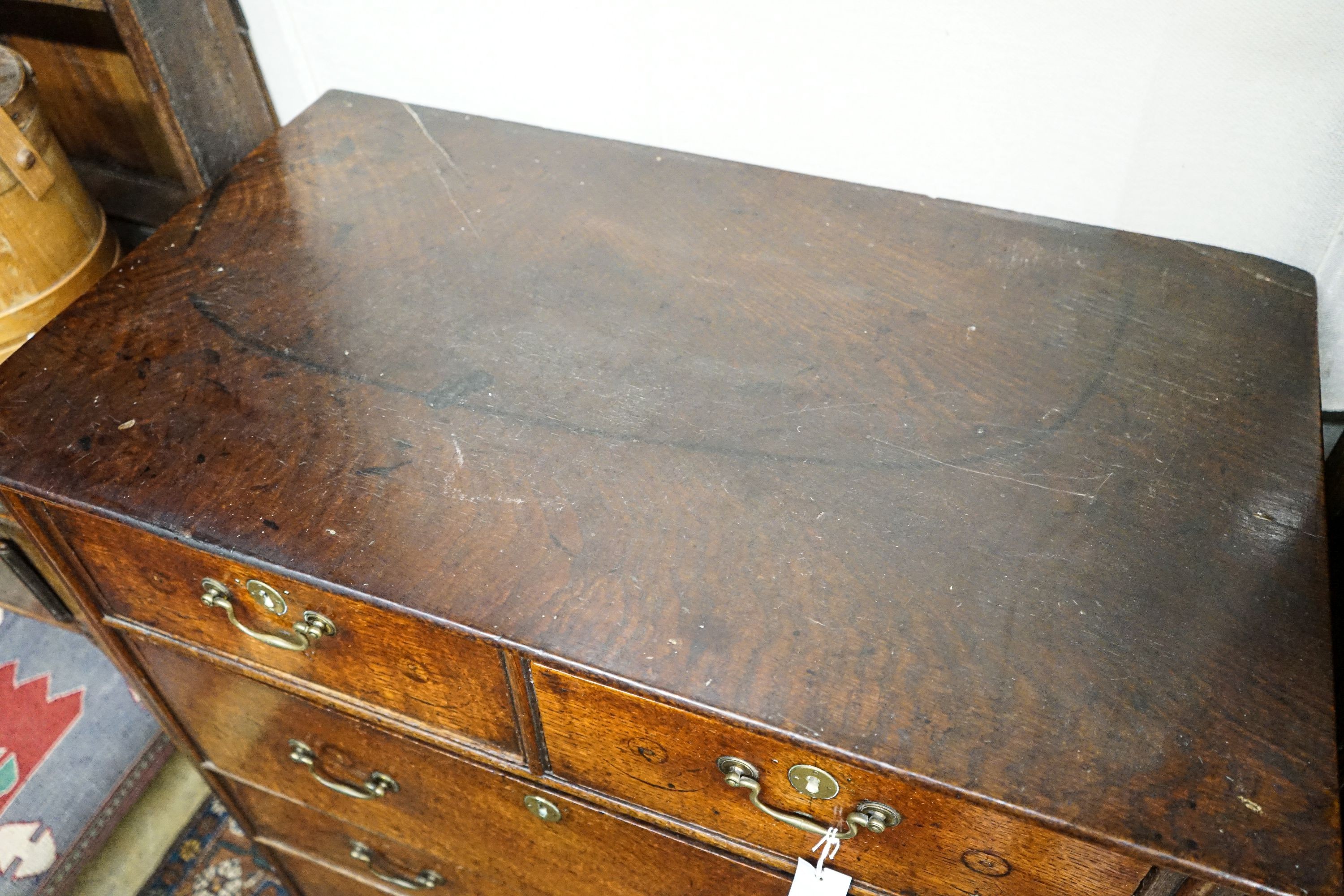 A George III oak chest of five drawers, on bracket feet, width 90cm, depth 52cm, height 103cm